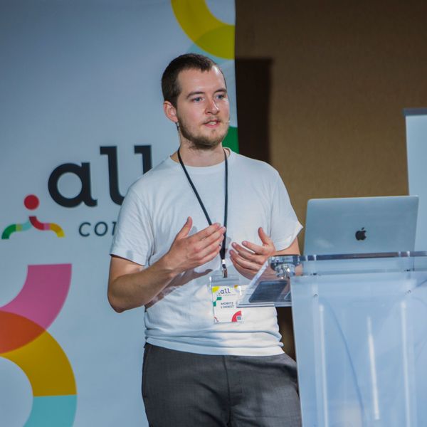 I’m animatedly giving a talk on a conference stage.